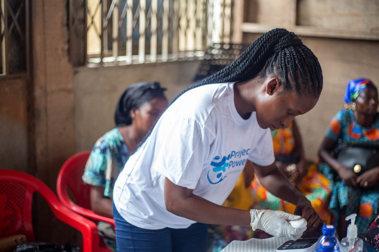 Volunteer performing health screening