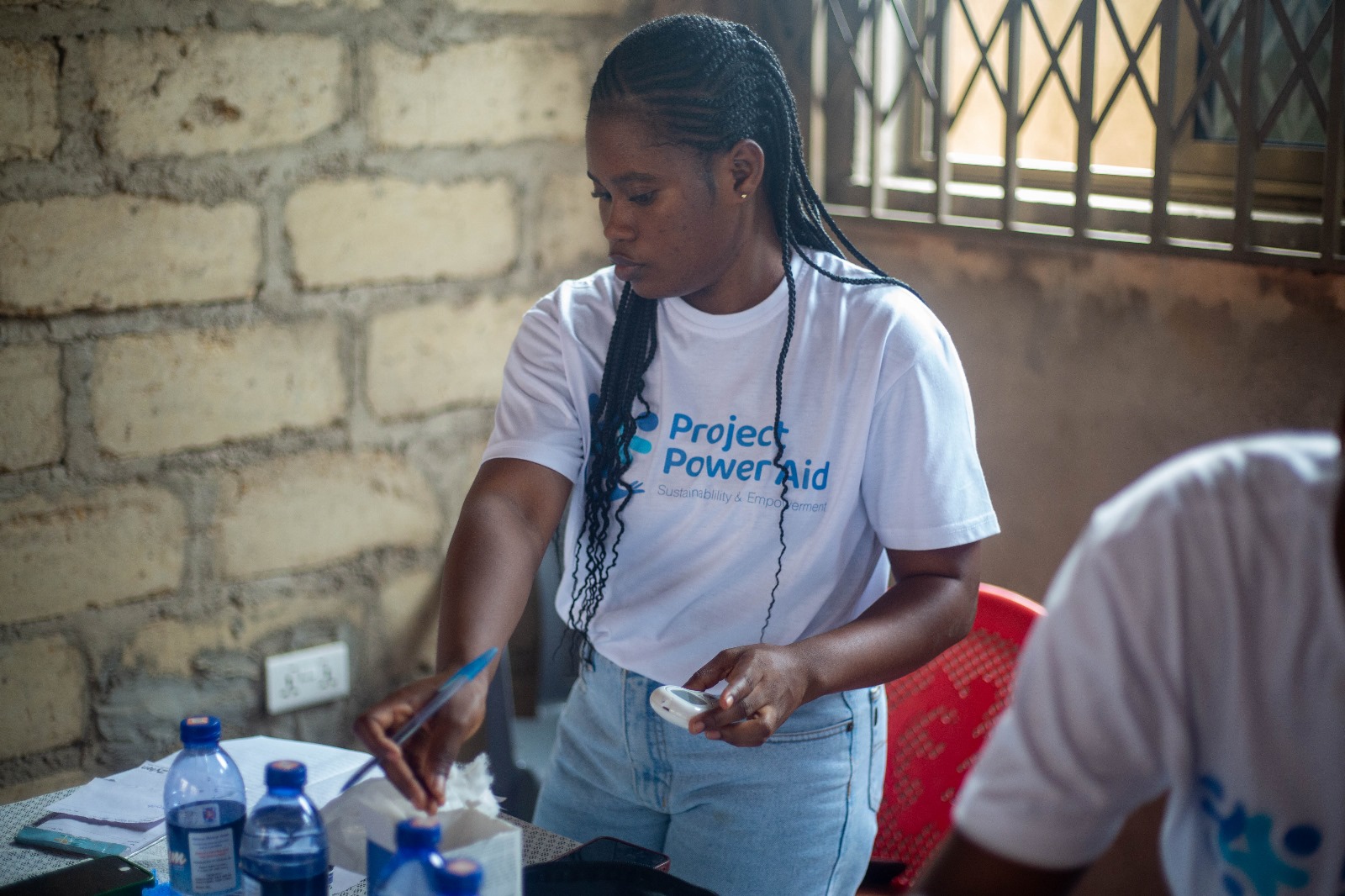 Volunteer preparing health equipment